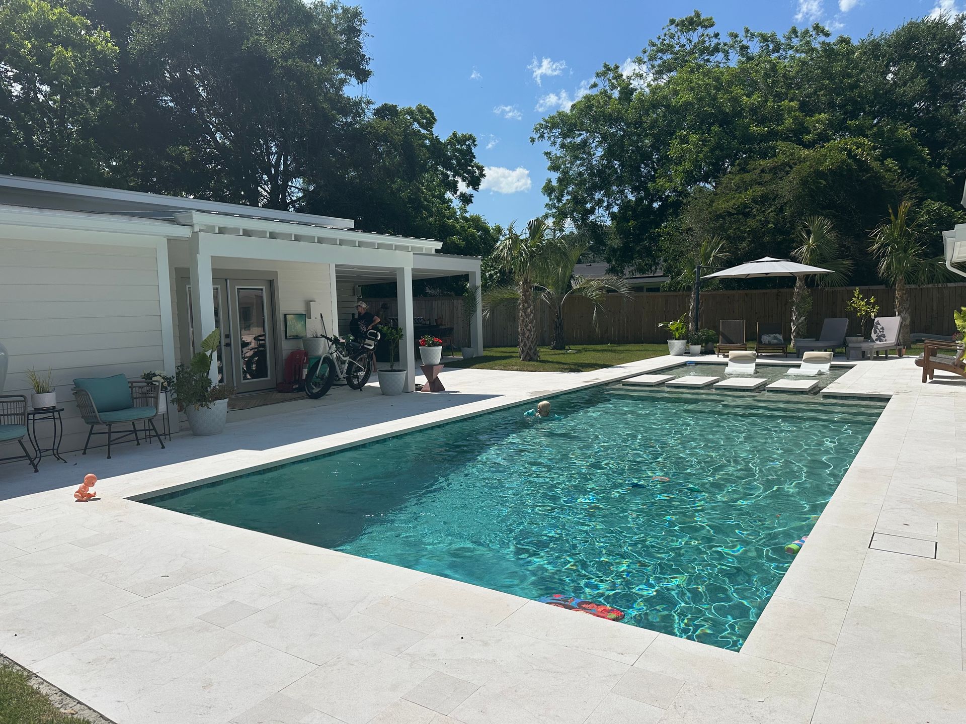Pool with covered poolhouse in daylight