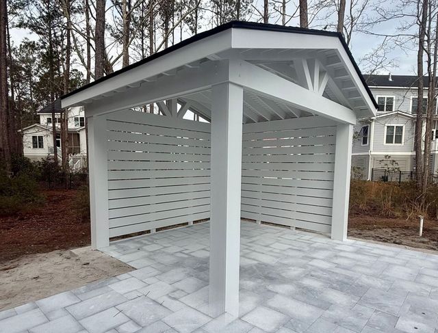 White gable carport with slat walls
