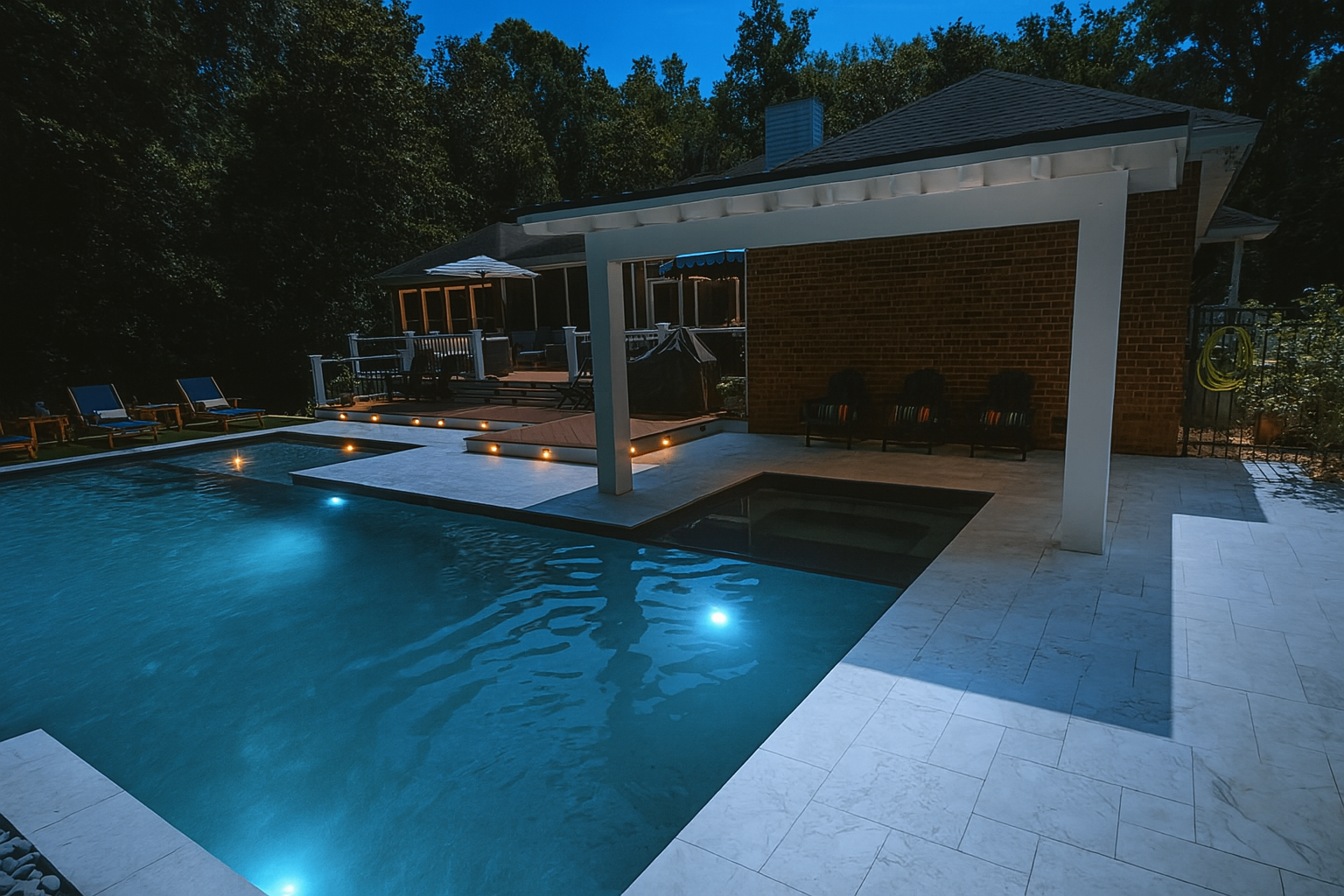 Pool and hip-roof pavilion at night