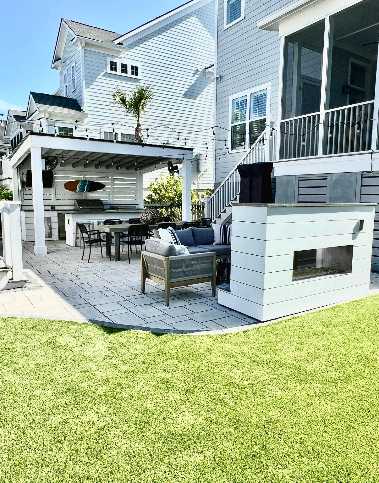 Outdoor pavilion with built-in fireplace and kitchen